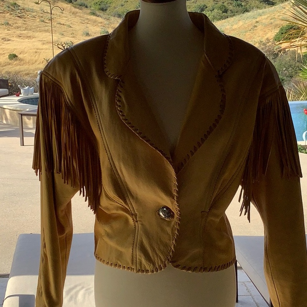 Short, natural leather jacket with fringe